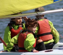 Children Sailing on boat across Chichester Harbour