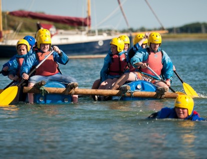 Group on Water Raft boat sailing across Chichester Harbour